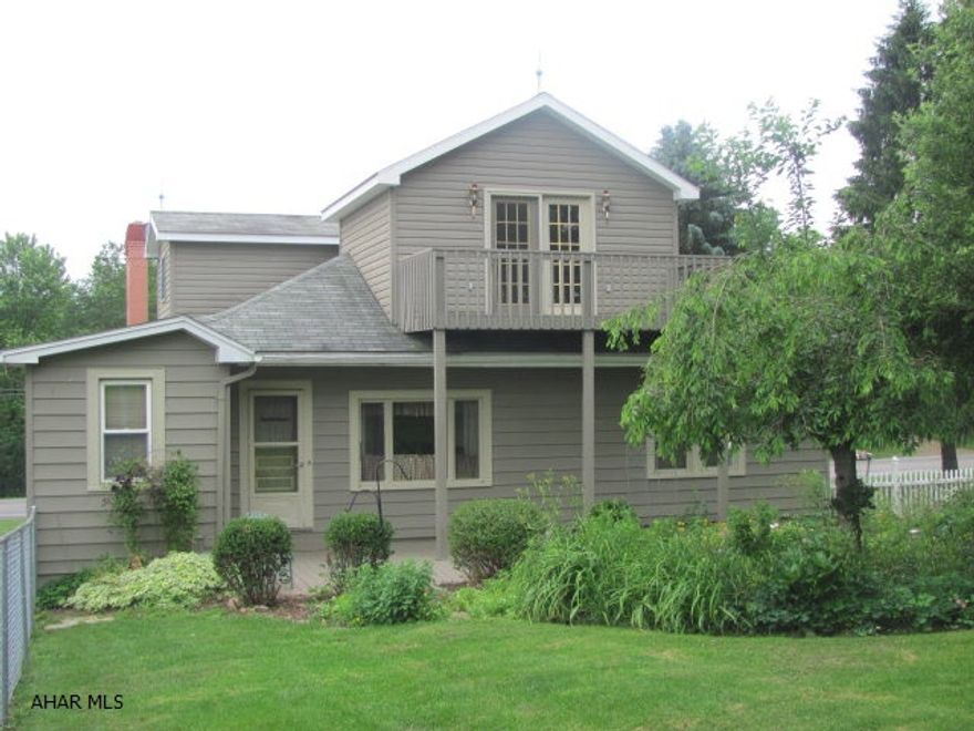 Country Craftsman home with wide oak trim, oak hardwood floors, oak boxing on the ceiling, oak colonnade and lots of stained glass. Newer furnace and windows. Dining room and living room are open and inviting with oak boxing. 4th bedroom makes a great office area. Large fenced back yard. 2nd floor suite is very private with private deck that overlooks farmlands and mountains. 2nd floor suite has 8X10 walk-in closet, full bath and new carpet newly installed for listing. 1st floor bath was remodeled in 2005 with jacuzzi bath.