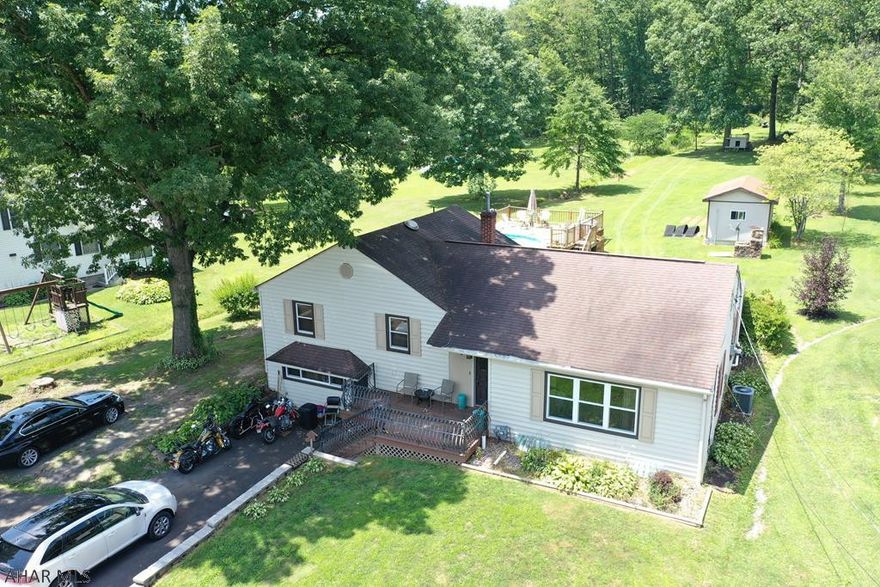 This is a MUST SEE updated split level home on Brush Mountain Road.  The home is situated on almost an acre with lots of features.  The main level has a large eat-in kitchen with included stainless steel appliances.  There is new flooring throughout most of the home.  Other features include 4 bedrooms, 2 full baths, office, bonus room with bar, central air, above ground pool, and shed.  This is a perfect location that is close to Hollidaysburg, Altoona, and I-99.