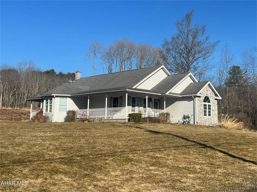 Experience the charm of country living in this stunning 4-bedroom ranch home. The wrap-around porch leads you into the functional floorplan where you will find brand new carpeting, ceramic tile and hardwood floors, fresh paint, and expansive windows offering plenty of natural light. The large living room features a gas fireplace with a soaring ceiling and open view of the loft above. The updated eat-in kitchen includes a center island, abundant cabinetry, pantry and stainless-steel appliances. The elegant dining room is bright and refined. The primary bedroom includes a private en-suite bath. Two other bedrooms and another full bath on the main level, as well as a 4th loft bedroom provide ample space for family or guests. Other amenities include a main floor laundry, radiant floor heating, central vacuum system, and an oversized 2-car attached garage. This move-in ready property with comfortable one-floor living is a must-see for anyone seeking a peaceful retreat with room to grow!