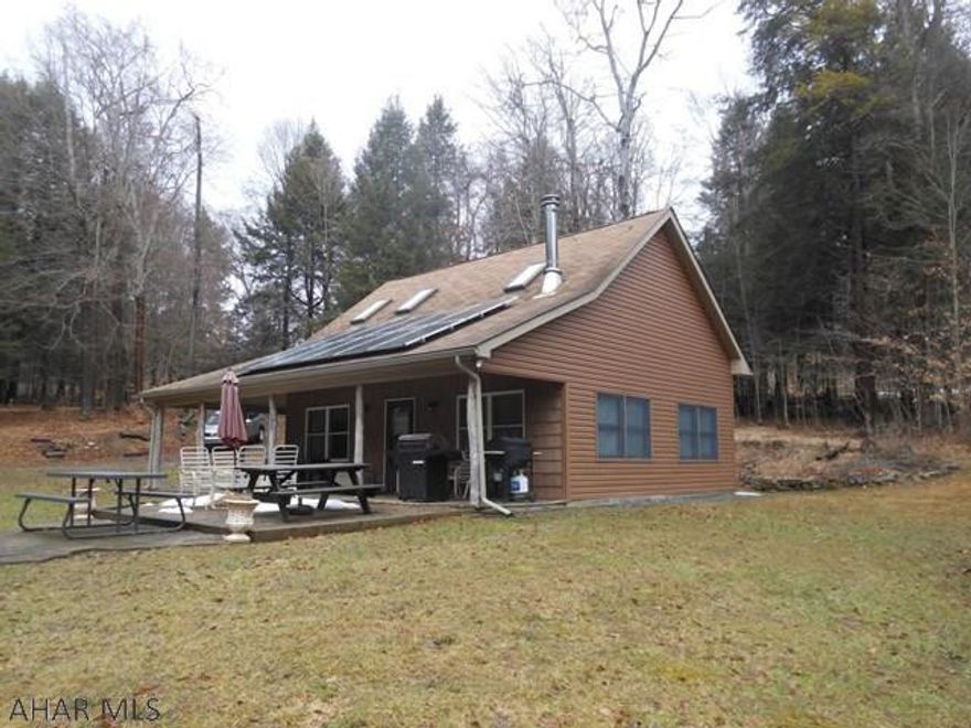 Beautiful, tranquil camp/summer home just off of Swartz Rd for easy access. This camp/summer home has a nice yard for activities and a wrap around porch. Solar electric system with backup battery so you have no electric bill!  Heated by a woodburner and propane. Close to game lands. Hickory kitchen.