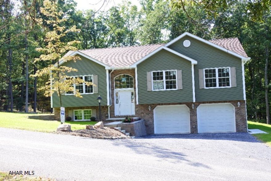 A rare find...new construction...plenty of time to choose your own flooring and colors.  Living room boasts a vaulted ceiling and big windows.  Spacious family room/laundry and half bath in lower level.  Composite deck over looks wooded backyard....yes, there are deer and turkeys!    Taxes will be assessed upon completion....currently they are based on vacant land.