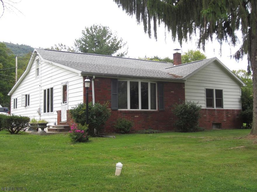 In a nice quiet country location with .59 acres, this property has much to offer. The 3 bedroom, 1 bath ranch home gives you 1 floor loving with lots of open space outside in a peaceful neighborhood. The open kitchen and dining room flow right into a large living room with oak hardwood flooring. The 3 bedrooms all have new carpet and hot water base is the heat. The exterior is brick and vinyl siding with a brand new roof in 2018. The over sized 2 car garage has a 2 bedroom apartment for potential added income. Storage sheds and extra storage. Buyer to confirm square footage and taxes.