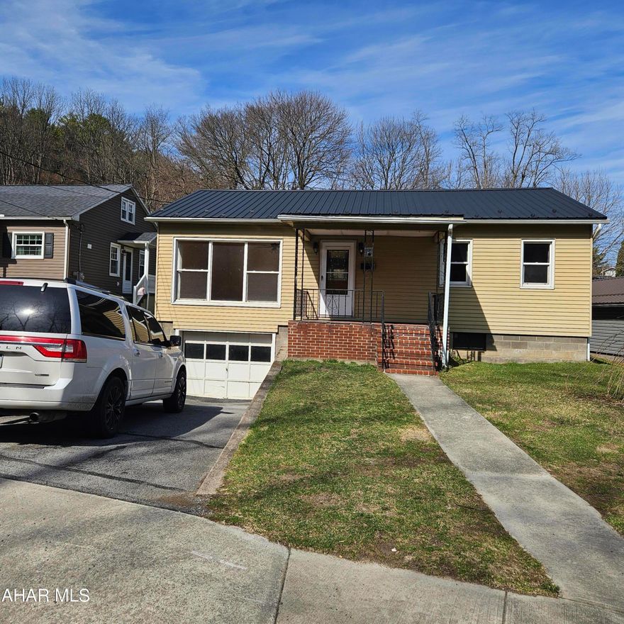 This charming one-story ranch offers a perfect blend of durability and classic style, highlighted by a brand-new metal roof that ensures years of low-maintenance living. Inside, the home features two comfortable bedrooms and a full bath, with original hardwood floors adding warmth and character to the main living area.

Practicality meets comfort with an integral garage for convenient all-weather access, while the outdoor spaces provide plenty of room to relax. This one story ranch provides easy, single-level living. Schedule a tour.
