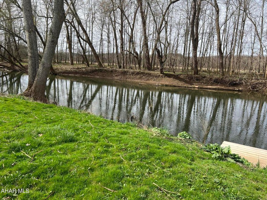 Ever dream of a weekend getaway (or Home Sweet Home) by a waterfront?  1.61 acres of flat open property along Dunnings Creek to place your camper, cabin or home on.  Water, electricity, sewer all there on site.  Give me a call today.