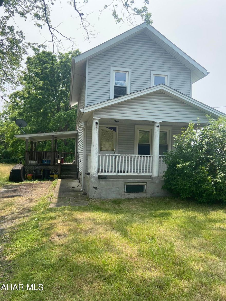 1.5 acres located in the Industrial Zone of Logan Twp. Two story home on site which could be used as additional income, an office or razed for a new building.