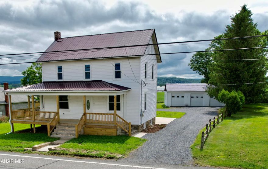 This beautiful 1920's Colonial home has been completely renovated keeping its character and charm.  The large rooms, high ceilings. original wood work bring this home to life. The large modern eat-in kitchen has recessed lighting, new cabinets, appliances, and fantastic countertops, a cooks dream.   The main bedroom has its own private bath and walk-in closet.  The secondary bedrooms are large with a ample closet space and an additional bathroom.  The side entrance has it's own foyer with a half bath and a separate first floor laundry room. New furnace with central AC, and many more updates. Lets not forget all the possibilities outside.  The beautiful  wrap around front porch has been completely restored. A nice size back yard brings the outdoor area to life.  This home has a 30x44 -3 bay garage.  This could be a commercial or residential property.  Previously there was an auto mechanic who worked out of the 3 bay garage.  So many possibilities with this home.  Don't miss this gem!