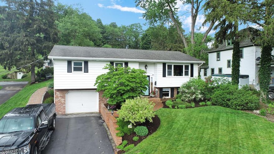 Gorgeous 3 bedroom, 2.5 bath bi-level house with a beautifully landscaped yard, partially covered deck, large yard and shed. 1 car garage. Large kitchen with an attractive wood island and ample cabinet and counter space. Finished basement with cozy family room featuring a gas-fired fireplace.