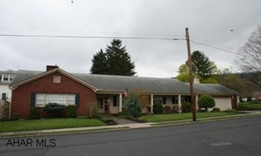 Spacious brick ranch on corner lot; ideal in-town location. Spacious brick ranch on corner lot; ideal in-town location. 3BR/2 full baths. Custom kitchen with new cherry cabinets; main level laundry room, large living room with cozy fireplace. Decorator Touches! Hardwood floors, ceramic baths, chandeliers, recessed lighting. Professional landscaping. Relax on the covered front porch or retreat to the back patio. 2-car garage, full unfinished basement w/fireplace, large yard or extra lot.