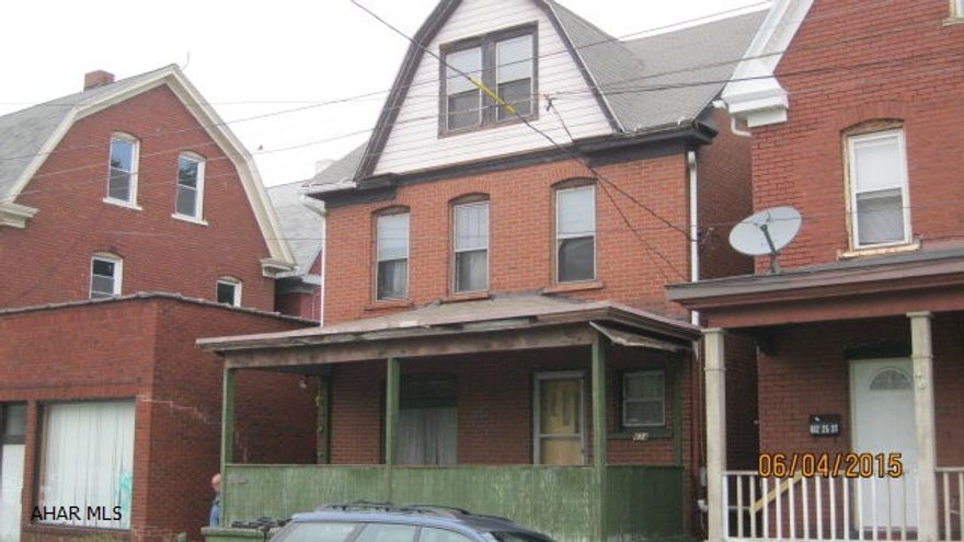 Solid brick home with good roof but repairs needed throughout. Good rental.
