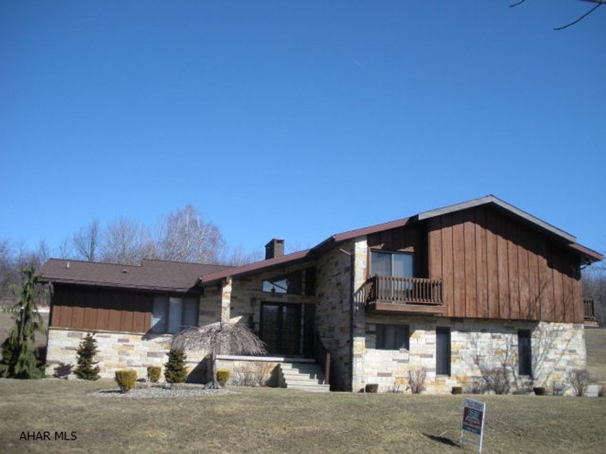 Beautiful Cedar & Stone 4 level home on private cul-de-sac. 4 bedrooms, 4.5 baths, 3 fireplaces, 2 family rooms, new oak hardwood floors, newer carpet in the family room. Balconies off 3 of the bedrooms. The kitchen is all cherry w/chocolate stain, granite counters, S/S Kitchen Aide appliances, wine service area with wine refrigerator!7 zone heat system, central vac. 2 car garage, covered patio-epoxy floor covering in garage and porches. Potential for rental income or in-law suite in lower level.