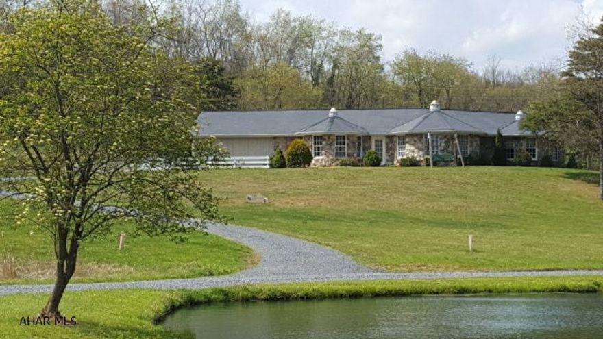 Custom home on nearly 4 acres - outstanding setting.  Stone and vinyl ranch overlooking tranquil pond.  Beautiful fireplaces and vaulted ceilings.  Large master bath with Jacuzzi tub and walk-in shower.  Main floor laundry.  Attached 2-car garage.  Convenient to Bedford.  Lovely home ready for you to move in and enjoy!