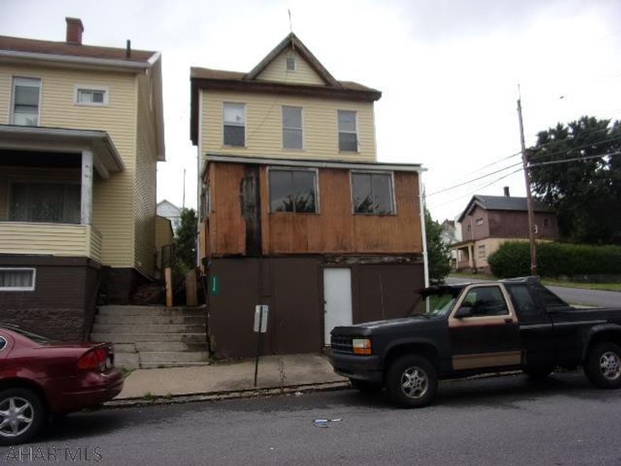 A real handyman special!!  Enclosed front porch in poor condition, use caution please.  Modernized kitchen and first floor laundry.  Decent sized bedrooms.  Gas hot water furnace and 100 ampere electrical.  Detached garage.  Utilities are on.