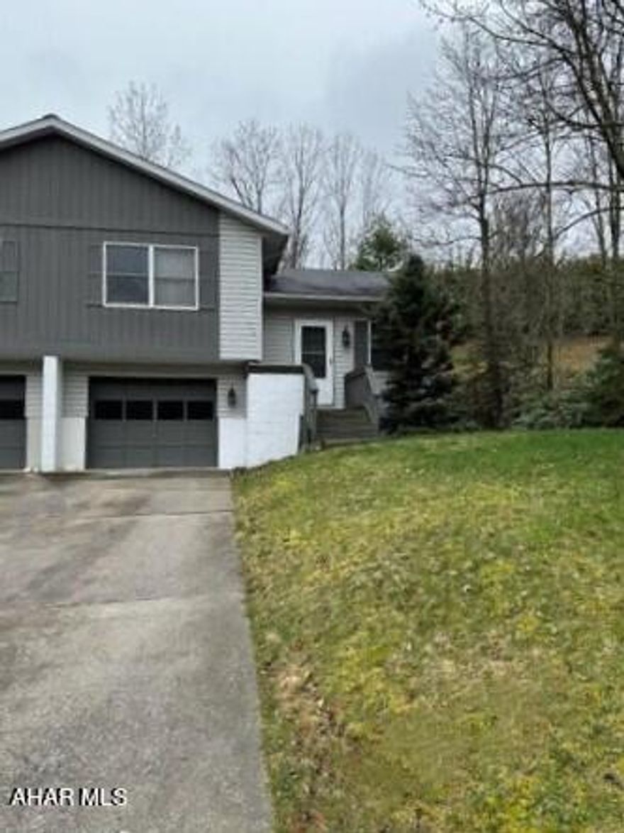 Easy living. 2 bedrooms. Plus possible 3rd bedroom in basement. 1 1/2 baths. Familyroom in basement. Back Deck. 1 car garage w/opener. Cement driveway. Electric heat. 2 electric storage unit in kitchen & living room.