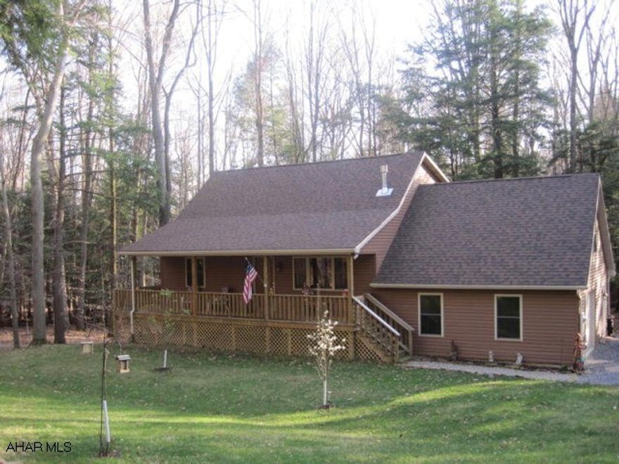 Immaculate Mountain Residence/Retreat.  Located on flat/dry 1 1/2 acres within a planned gated community.  2 story, 2-3 bedroom, 2 1/2 bathroom home.  Open floor plan, cathedral ceilings and loft area.  Beautiful oak kitchen with commercial grade stainless appliances and island.  Master bedroom suite with library/office and walk-in closet.  Guest bedroom and additional bonus room/ 3rd bedroom.  Two propane stoves.  Wrap around porch and decking.  Ready to finish walk-out basement.  Includes extra large one car garage and new storage shed.  All this and more situated near lake, fishing areas, and State Recreational Vehicle Park.  Truly a must see property!  Owner offering $3,000 seller's assist.