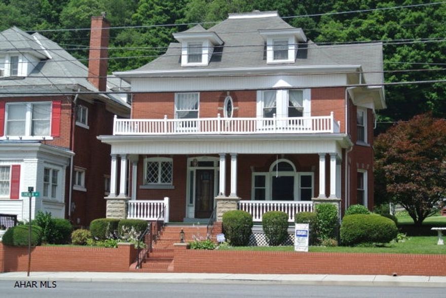Tyrone Borough. Classic stately brick across from Soldier's Park. Very well maintained. Hardwood floors, pocket doors, beautiful original wood work, off street parking, shed. Lots or perennials.  Currently the property has a security system.  The new owners would need to buy out the remaining contract if they wanted it.