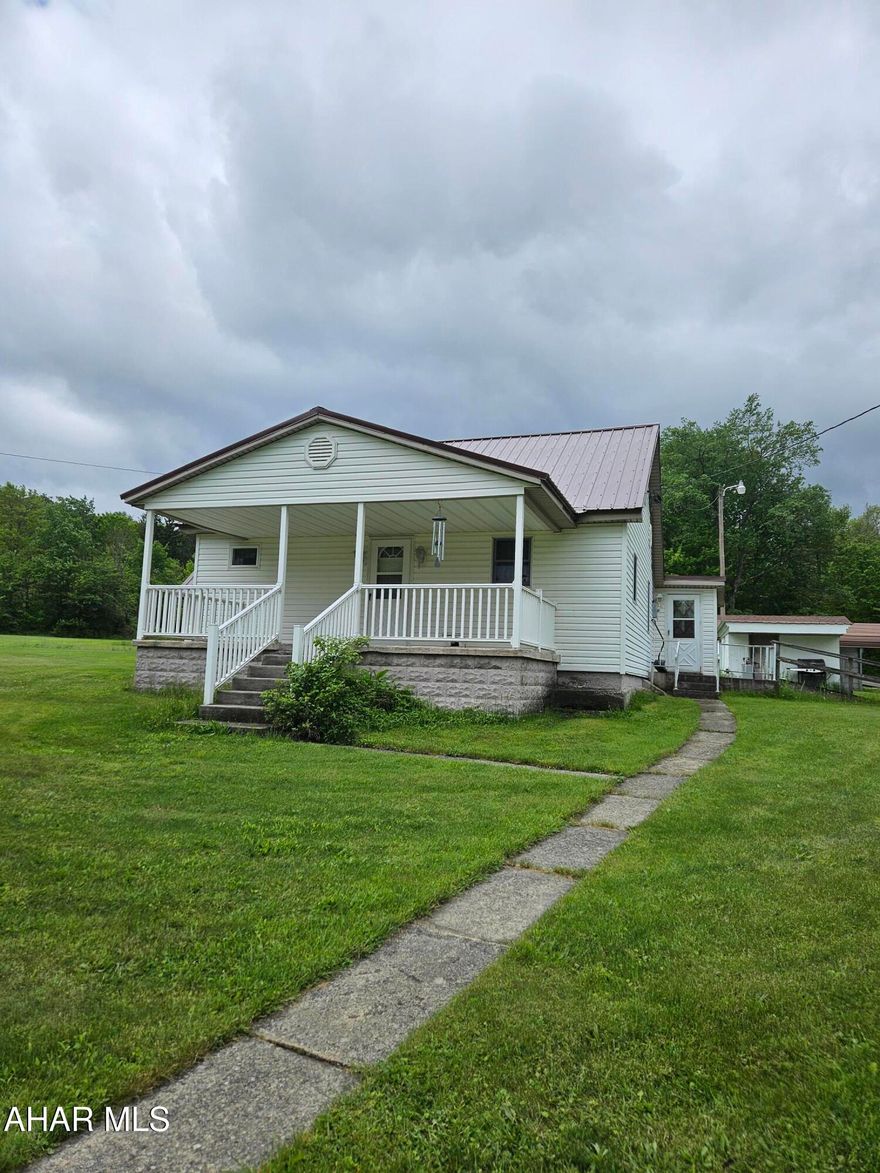 This property features a charming home with an eat in kitchen, dinning room, living room, full bathroom and master bedroom on the first floor. the second floor has 2 spacious bedrooms. Set on 9.6 acres, this property also includes a very spacious 3 bay garage with a separate well for added convenience. 
Call to schedule your showing today.