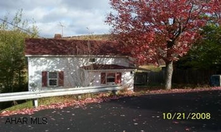 Small 1 and 1/2 story in Patton Boro   Chest creek runs directly behind property.