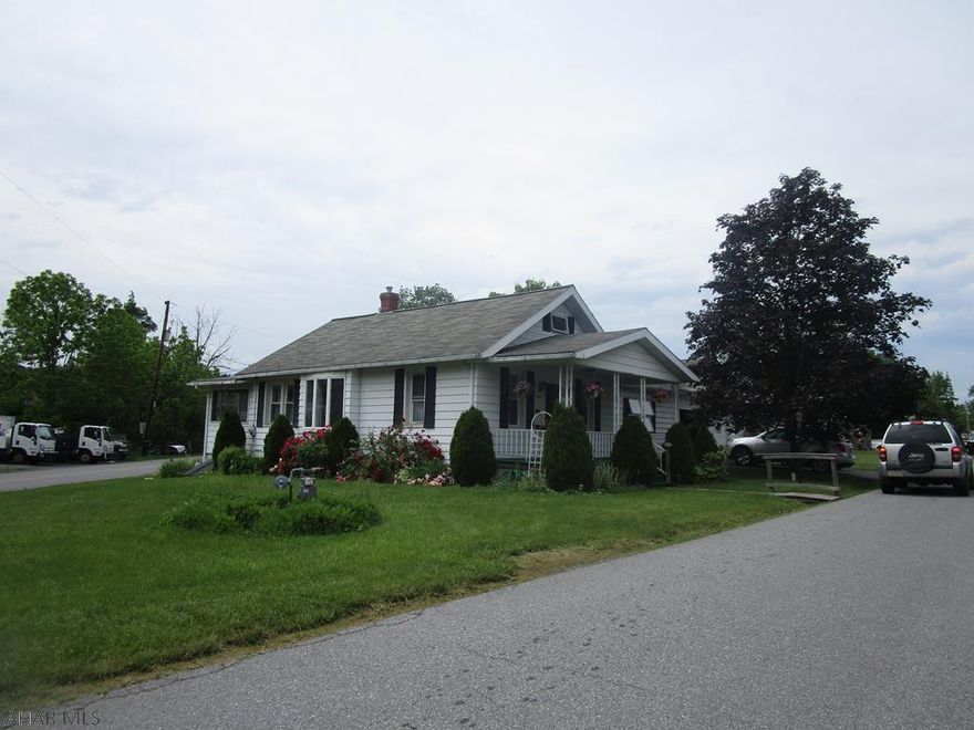 Vinyl sided 1.5 story home in a great location. Being sold to settle estate this home features living room, kitchen with appliances, dining room, enclosed rear porch, 2 bedrooms and laundry on 1st floor. Second floor has a heated bedroom (lower ceiling). Attached two car garage with auto openers. Utility shed.  Nice home for the $$.