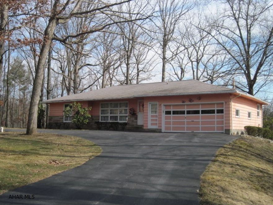 Nice ranch with 1.49 acre level lot bordering woods in rear, beautiful stone fireplace in family room.  Newer sunroom built in 1993. House roof approx 14 yr old, sunroom roof 8 yr old. 100 amp CB. Possible laundry on 1st floor. Nice 2 car attached garage with opener.  Pool table included.Central Air. Macadam circular driveway.