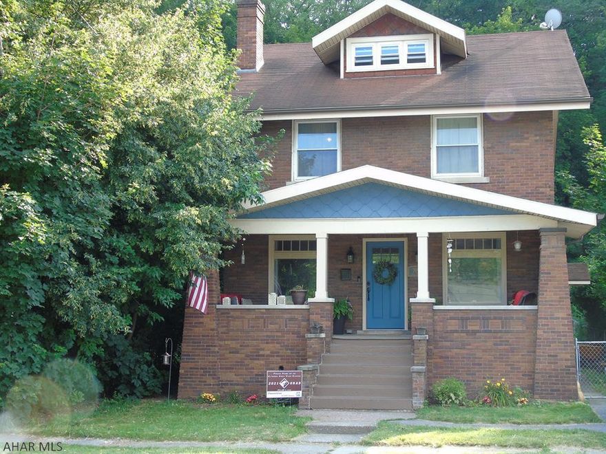 **Brick Beauty** Looking for the perfect home for your family?  This large, inviting brick home boasts of 4-5 bedrooms and 2 bathrooms.  This home's character sets it apart from others with it's beautiful hardwood floors, large pictures windows that allow in an abundance of natural light, and a brick, wood burning fireplace with built-in bookshelves. The first floor laundry room is right off of the recently remodeled eat-in-kitchen. Store your shoes and jackets in the lockers located in the mudroom.  This home also offers an office/playroom area!  It has newer windows, a newer furnace, and a newer water heater.  In addition to the off street parking spot in the front of the home, there are two additional parking spots in the back through the alley.