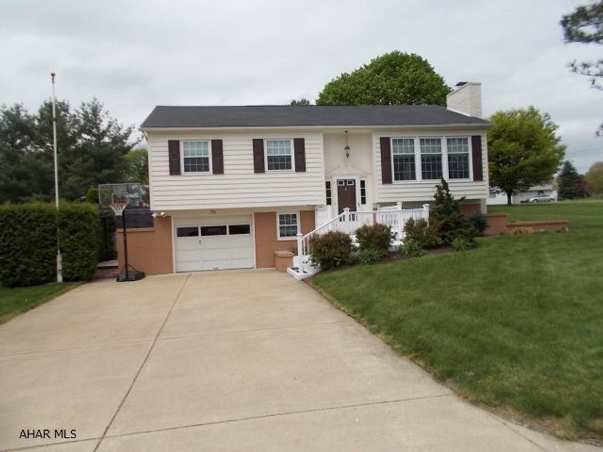 Lovely and immaculate home on large flat lot !. Beautiful natural stone fireplace (natural gas),very attractive newer wood & metal railing, newer appliances, fixtures. Totally refurbished 3/4 bath w/ tile shower. Family room plus bonus room that could be office, toy room or even walk -in closet. Workshop area in garage and laundry room. Comfortable screened in porch off dining area. Great back yard for entertaining and room for a pool too ! Beautifully maintained and ready to move in. !