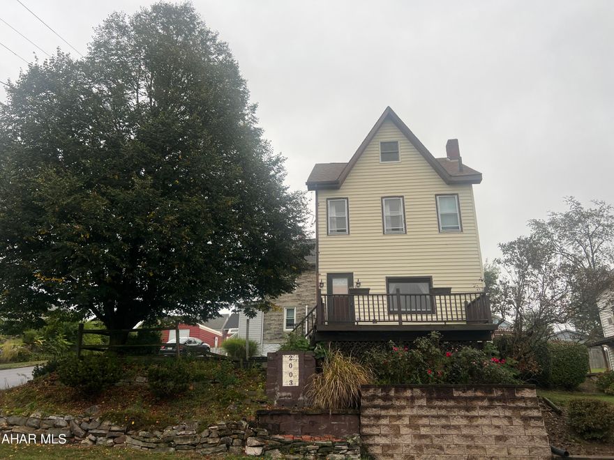 Move right in to this 3 bedroom home with 1st floor laundry for convenience. There are 2 nice sized bedrooms and full bath on 2nd floor. The walk up attic is finished for the 3rd bedroom. This home sits on a corner lot with off street parking. Sit on the front porch and enjoy the view of the city! Don't wait, call to schedule a tour and be home for the holidays!