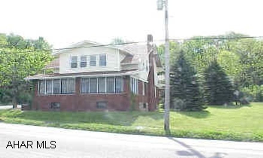 Modern kitchen & baths.  Large corner lot brick home. 1-car det garage.  Pretty wood work,  brick fireplace, & glass french doors into dining room.  Heated sun porch.