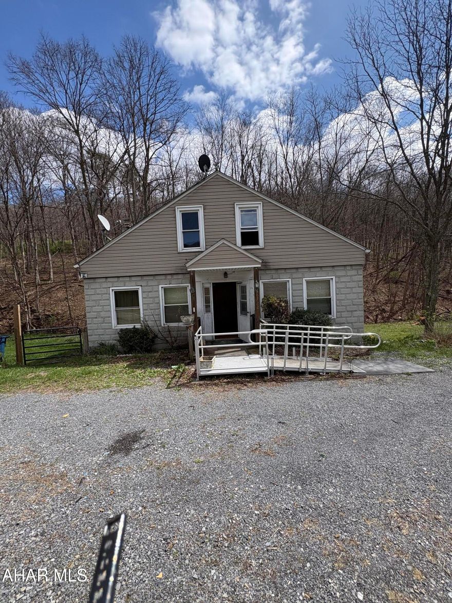 Investors, carpenters and handymen--start your engines.

This approximately 1,700 sq ft home on 0.88 acres at 8722 US Route 220 is ready for a full remodel and offers a fantastic opportunity for those looking to bring a vision to life. The home has 'good bones,' with a solid-looking foundation and a layout that lends itself well to renovation.

The main level features a spacious family room with wood stove, a formal dining room large enough for gatherings, and a generously sized kitchen ready for your personal touch. Just off the kitchen is a full bathroom and a main-floor bedroom ideal for those seeking one-floor living.

At the rear of the home, you'll find a heated ~300 sq ft laundry room with ample space for something new. Given its proximity to a large pantry and screened-in porch, this area could be reimagined as a summer kitchen or additional living space.

Upstairs offers three additional bedrooms. One captive bedroom presents a potential opportunity to create a second full bathroom.

The walkout basement is spacious and appears to be dry. Mechanical systems, including the furnace and water heater, are not new but appear to have useful life remaining.

Outside, a solid outbuilding with a concrete slab and hardwood-framed floor-formerly used as a woodshop, adds value and flexibility. A table saw is included and can remain with the property.

Conveniently located approximately 8 miles from Cumberland, 7.2 miles from downtown Bedford, and within the Bedford Area School District, this property has strong resale potential once completed.

Motivated seller. Bring your ideas and make it your next project. Call me today to schedule a showing or to learn more.