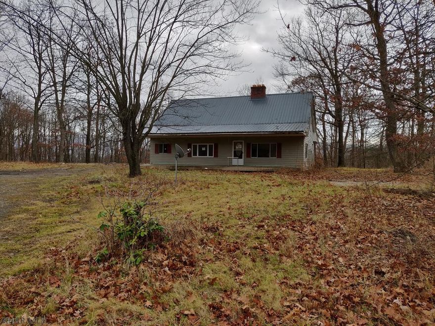 Secluded Hollidaysburg Home in the Woods on 6 Acres. 3 BR 1.5 Bath Two Story Home with a Separate Single Wide Mobile Home. Needs Rehabbed. All of Your Hard Work Will Pay Off. Private Spot with Acreage and Great Potential.