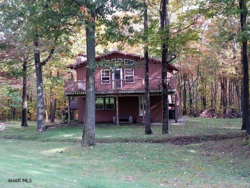 PRICED TO SELL!  Great price for a TRIPLE unit on the golf course!  Enjoy the golf and outdoors in the summer and skiing in the winter!  Beautiful, fully-furnished Blue Knob mountain retreat on 9th tee!  Three separate living areas for each family or for your guests!  Spacious deck, separate electric, 1 fireplace, and 2 woodburners.  Association fee only $300 per year.  J-241