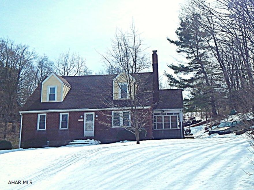 Country living is what you will experience in this 4-5 BR,1 3/4 bath brick & vinyl, bright & cheery, exquisitely maintained home. This home boasts a fireplace, family room, living room, dining room, & a 3 season room situated on a 1 acre lot.  Set your personal tour.