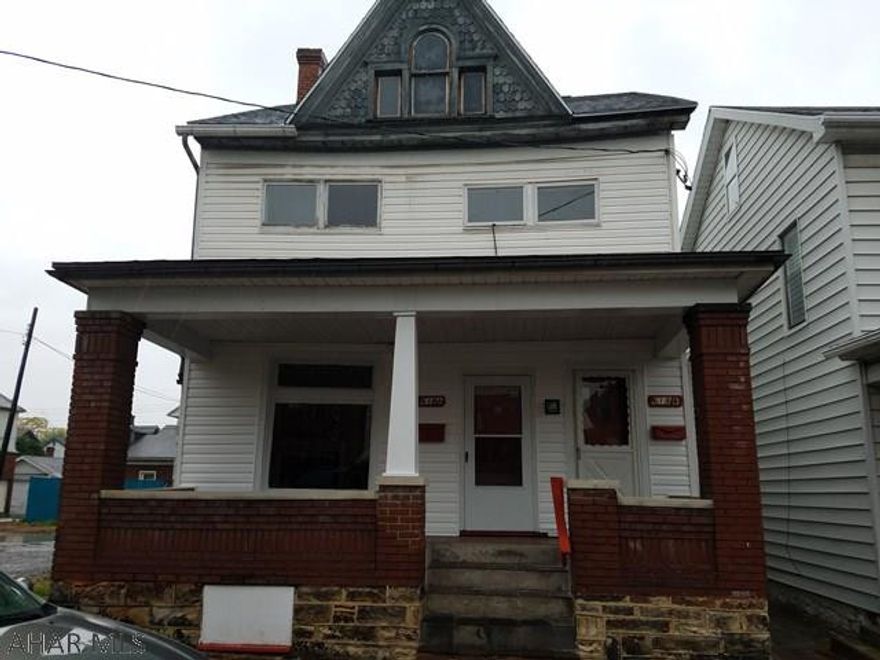 Great opportunity for investors! This property includes a large corner parking lot, brick home currently duplexed into: 1st floor 1bedroom 1bath with living room and kitchen - 2nd floor 3bedroom 1bath with living room, and kitchen. The basement of the home features laundry hookups. This home is move in ready with a current renter's certificate. The Yellow home in the rear is  2bedroom 1 bath home. This home has a new roof, new windows, new 100 amp electric panel and new exterior paint. Home will require interior repairs. Rental income potential, or live in one home and rent the second! Call listing agent for more information.