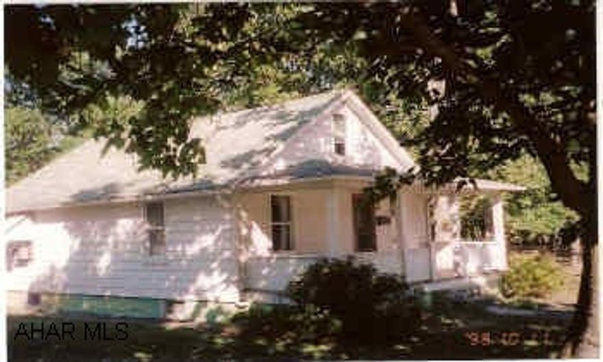 Small home on the outskirts of town. Outside newly painted, roof 2 yea4rs old, nice flat yard, 2-car detached garage with electric.