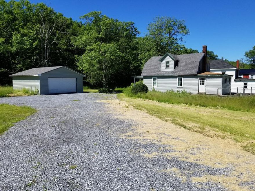 3 bed, 1 bath home on the tippy-top of Buckhorn Mountain!  Plenty of lush grassy yard in the front, and thick woods in the rear. Large 2-detached garage. Nice starter home for a handy-owner, as this home needs some finishing touches. Schedule your tour today. Motivated Seller!!!