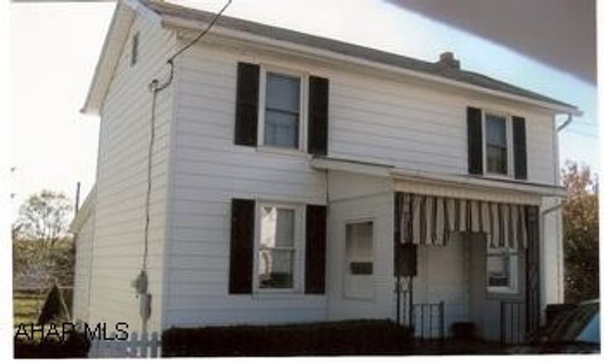 Two-story, in town, move in condition. Small fenced yard, great starter home or good investment. Home has large kitchen, full basement / walk-out, rear covered deck, front covered porch, fenced yard and newer windows.
