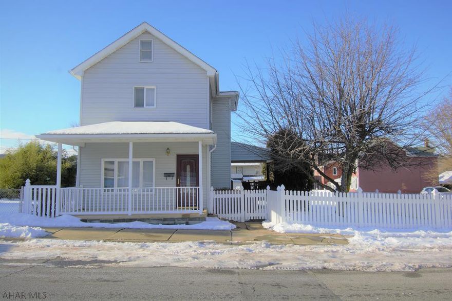 TREASURED TWO-STORY--This 3 BR home has been impeccably maintained by the owners & will make a beautiful home for the next. Upon entry you'll love the layout & seeing directly back to the timeless kitchen with beautiful cherry cabinets, ss appls & lots of counter space-incl an island & breakfast bar! Upstairs are 3 BRs & an updated bath. The attic serves as excellent storage & the basement is also very clean. NEW Furnace (2020). Outside is an amazing covered porch that can almost be classified as a room itself with half-vaulted ceiling & cable hookup. You're sure to spend plenty of time on it! Home sits on a double lot that's fenced, incls two paved off street parking spaces & shed. Wait until summer & you're in for a sweet treat with an apple tree, cherry tree & raspberry bushes to enjoy!