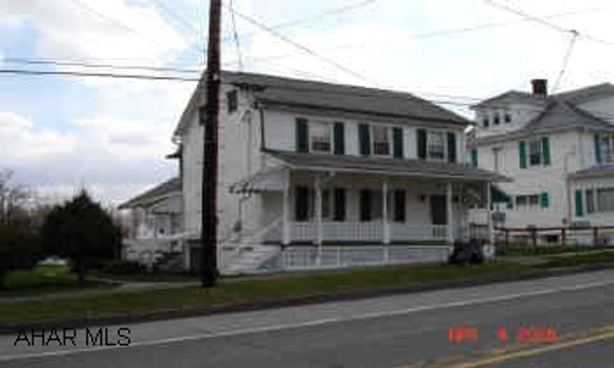 2 story Frame house Nice home, for the money, in Schellsburg Boro.  Large level lot w/off street parking, w/detached wood garage.  Pine & Alloc wood floors. Nice flow to house; kitchen laundry area.  Full unfinished basement w/walk-out.  Several rooms have been completly redone.  One bedroom is held captive (go through another bedroom to get to the other).  Two covered porches.  Dining room light & refrig. are not included.