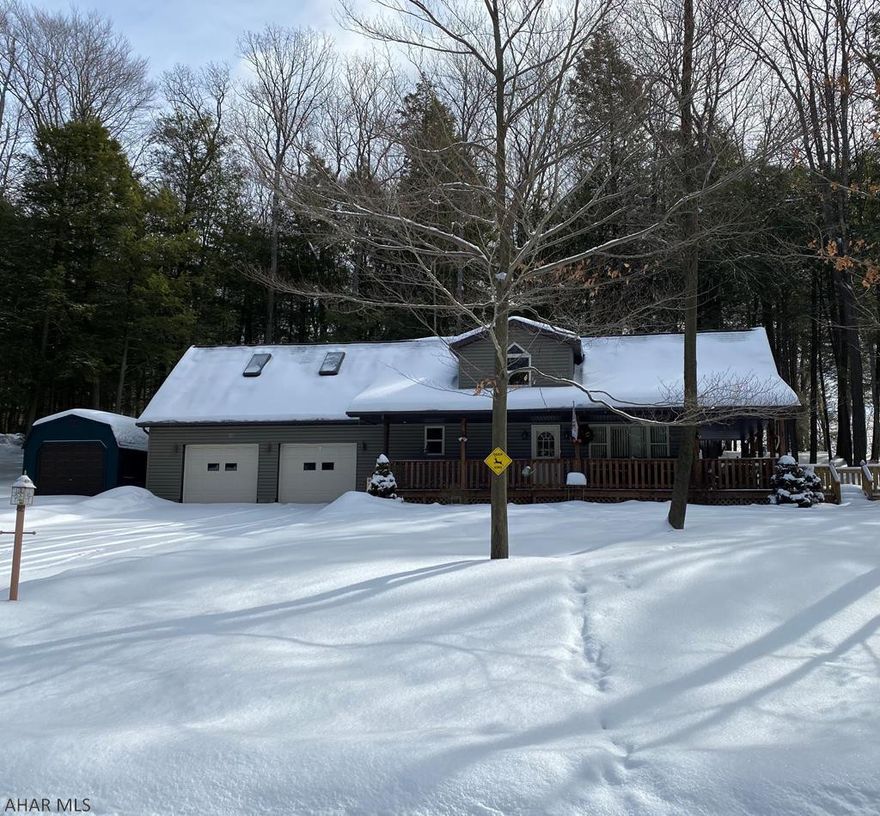 Move right into this beautiful 2-3 bedroom home situated on a 1 acre private wooded lot in Glendale Yearound. Open concept kitchen/family room. Finished game room/family room on lower level.  2 car oversized garage with lots of storage space. So many updates have been done to this home in the past 3 years! Association dues are $550 a year and includes security, trash, road maintenance & maintenance of recreational facilities such as the club house, swimming pool, dog park, playgrounds, pavilions, tennis/basketball/volleyball courts. Watch the wildlife from the new deck. New air/heat pump in 2018. Close to Prince Gallitzin State Park and lake.