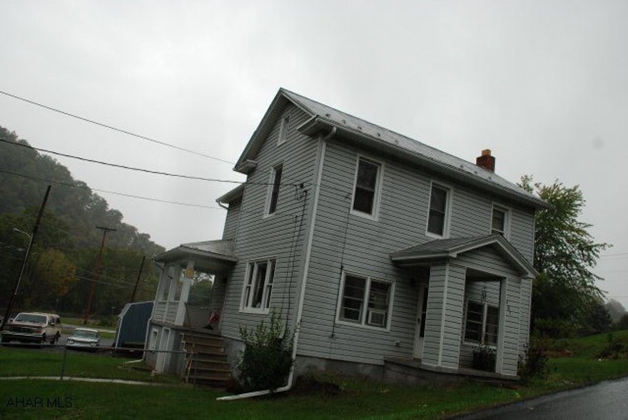 nice vinyl sided home with stone woodburning fireplace hardwood floors, 3 bedroom 1 bath, 24 x 24 2 car garage, 8 year old oil hot water furnace,vinyl replacement windows on 2 floor,near lake Raystown, and yellow creek.