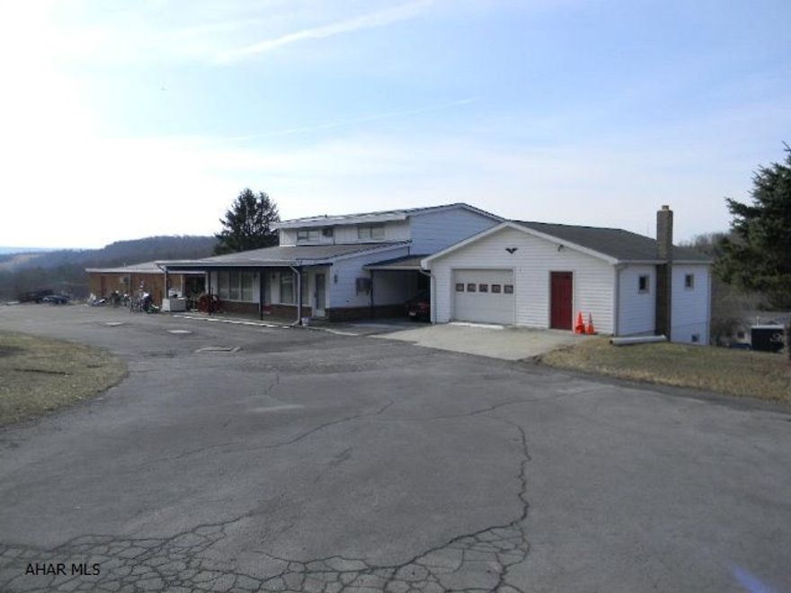Unique investment opportunity that provides immediate income. The main structure, situated on 1.65 acres, contains 8688 sq. ft. of floor space, includes a 2880 sq. ft. residence, 2184 sq.ft. sub-dividable retail space and six 13' x 24' rooms with fully tiled baths, easily convertible to apartments. Plus, a 2-level over-size 2-car garage and an additional income-producing amenity. This is a well-constructed building in above average condition priced at less than $20 per sq.ft. An incredible buy! Showings are scheduled by appointment only.