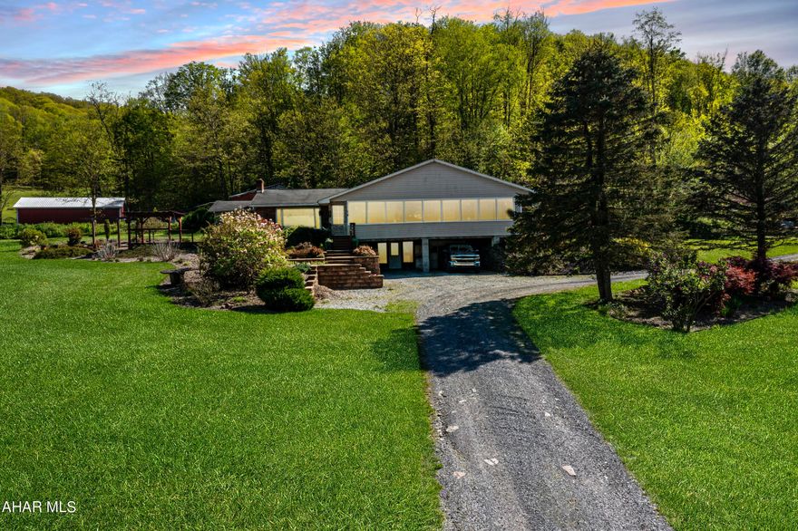 Turn your dream home into a reality with this incredible property located in the Hollidaysburg School District! This 3 bedroom, 3 bath home is situated on over 4 acres of charming land, complete with a beautiful pond consisting of bass, blue gill, and sunfish. You'll also discover a barn and plenty of additional space to explore. There's an outside patio featuring a fireplace, and a pergola perfect for entertaining guests.

The house itself is a true gem, offering a 1-car integral garage and a 2 car carport for all your parking needs. Inside, you'll find 2 bedrooms that act as master suites, each boasting its own attached bathroom  for added convenience and privacy. The main floor features a laundry area, making chores a breeze.The basement is a versatile space that can be transformed into whatever your heart desires. Need an extra bedroom? No problem. Looking for a home office or fun game room? The options are endless.

Don't miss out on this incredible opportunity to make this dream home YOURS. Call today for your own private tour.