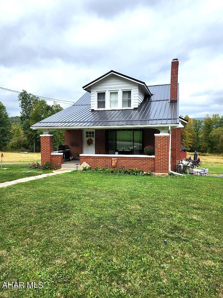 Charming 1.5-story brick home situated on 3.025 acres in a peaceful country setting just minutes from Bedford. This inviting property offers 2 spacious bedrooms and 2 full baths with a bright, open-concept layout that combines the kitchen, dining, and living areas—perfect for everyday living or entertaining.

An additional room at the top of the steps provides flexible space that could be used as a home office, guest room, or third bedroom. The full, unfinished basement provides plenty of storage and potential for future living space.

Outside, you'll find a large 40x60 barn—ideal for storage, hobbies, or small livestock—and open acreage with beautiful countryside views. Whether you're looking for a quiet retreat or a place to enjoy outdoor living, this property has it all.