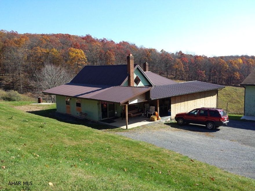 2 bedroom rancher on 10.417 acres near Tyrone. Large enclosed rear porch. 2 car detached garage with shop and full basement. Large frame bank barn.