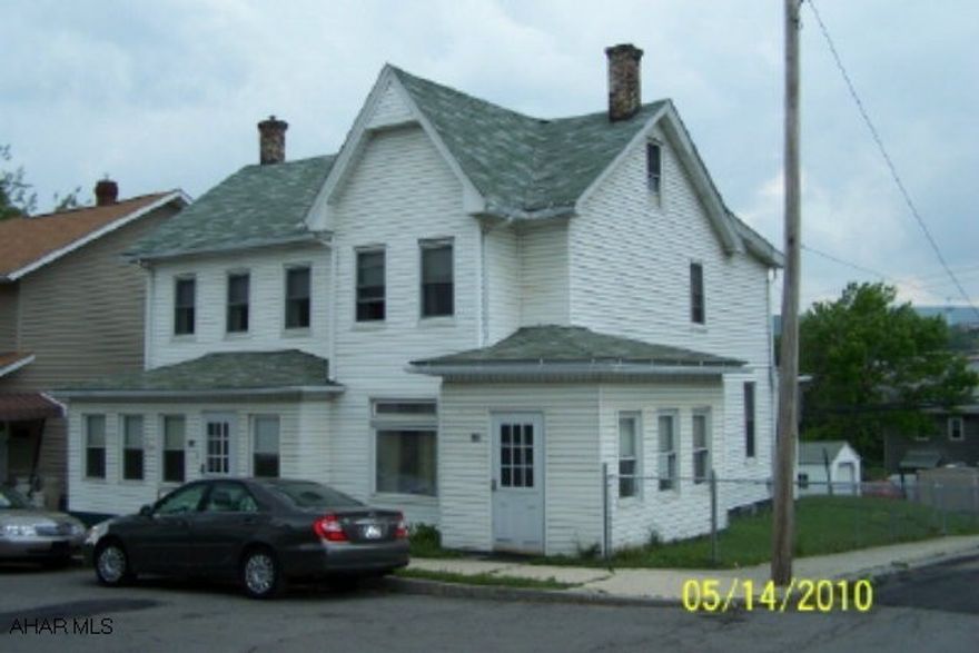 Landlord's dream - All separate utilities.  Well maintained, side-by-side duplex with vinyl siding, new roof in 2004, newer windows & furnaces, separate fenced-in yards, a detached garage, corner lot, enclosed porches & central air.  Each side has an enclosed front porch, a living room, dining room, kitchen, mudroom, 3 bedrooms, & a full bath.  One side has a shower in the basement & a walk-up attic.  Priced to sell.  Better hurry.