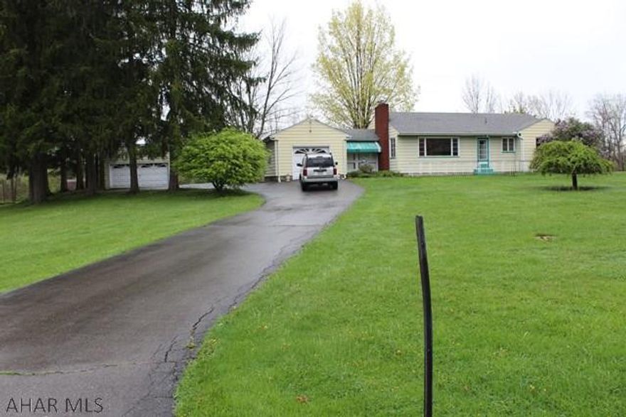 Easy one floor living, great 2 bedroom starter home or a house to downsize, on approx one acre of land in the Bellmeade Subdivision.   Attached single car garage and detached two car garage, screened in breezeway, gas connection for BBQ in the back yard, water softener, UV light, central air and gas fireplace in this lovely quiet neighborhood.  Needs some TLC.  Restaurants and shopping conveniently located near home.