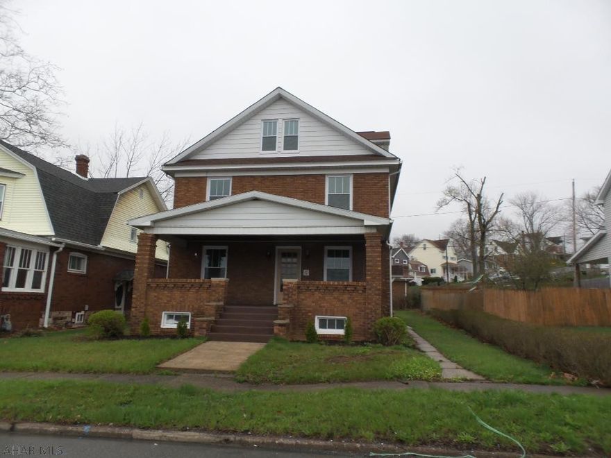 Completely modern with charm of the original craftsmanship!  Patterned hardwood floors and original woodwork have been preserved in this spacious 4 bedroom home featuring 1.5 baths.  The dining room is lit up from natural light pouring into the large bay window and features the original stained glass windows to the North.  Leaded glass built-ins trim out the large foyer.  New cabinets and stainless steel appliances are offered in the eat-in kitchen that has floor to ceiling built-ins as a perk!  3 roomy bedrooms on the second floor with an enormous full bath featuring both an over-sized step-in shower and tub.  The third floor is the perfect Master with ample space!  All new Anderson windows, new electric, newer furnace and hot water tank make this all brick a maintenance free home!