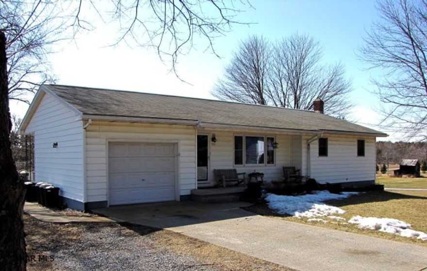 Peaceful, quiet country living! The Lot on right side (facing house) to the corner is included. Pool is included or can be taken down. All appliances in the eat-in kitchen are included. This home has lots of natural light. Could be converted to handicap accessibility with little modifications. One car garage, front porch, cement driveway, back patio.  All new windows. A must see!!