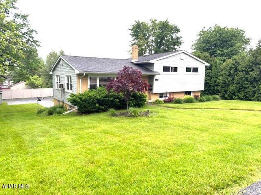 Lovely Pleasant Valley home with a desirable multi-level design.  3 BR, 2 BA, lower level family room.  Hardwood floors, fresh paint throughout the interior.  Newer windows.  Sun porch.  Garage and plenty of off street parking.  Large lot.  Location close to everything!