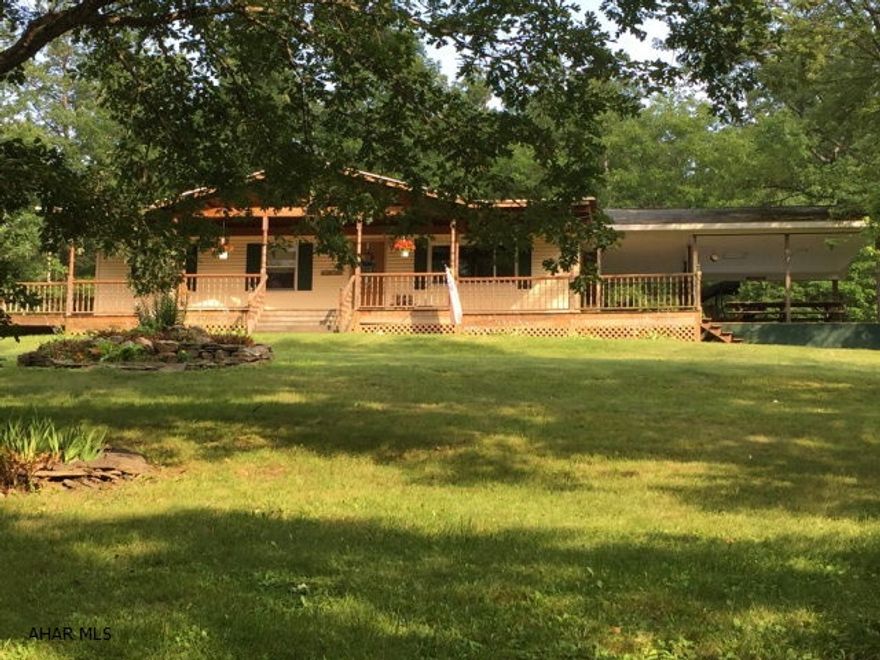 One level living in peaceful 2+ acre setting. Large family room with cathedral ceiling and French doors. Covered wrap around deck leading to 24' above ground pool. Great family property.