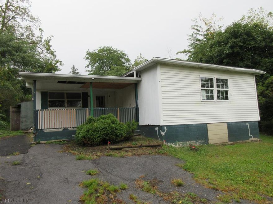 Altoona/Sugar Run area vinyl 1 story home with large 1.22 acre lot. Large home with over-sized detached garage, but needs work throughout. Perfect for handy persons. Property sold AS-IS. Seller will make no repairs. Offers must be submitted through HUD approved broker. Buyer pays both transfer taxes. Exclusive Agency. Equal Housing Opportunity.